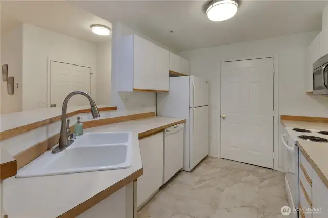 Kitchen with access door to garage
