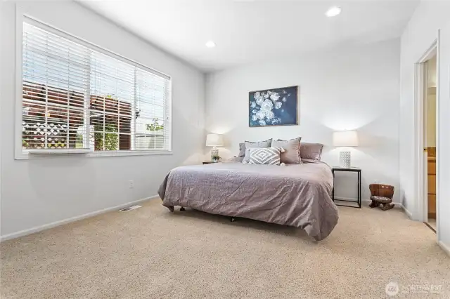 Spacious primary bedroom has updated bath suite and large walk-in closet.