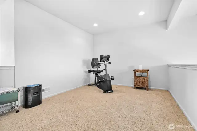 Upstairs loft space lends to a multiple of uses: office, gym, tv room...