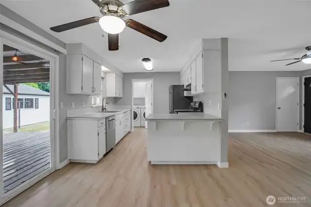 Crisp and clean galley style kitchen has everything you need at your disposal.