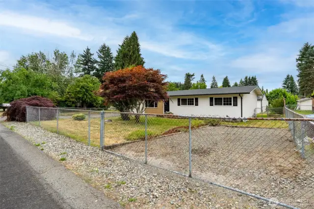 Fully fenced front yard.
