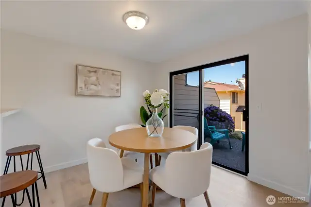Your dining space opens to the sliding door to the lovely patio