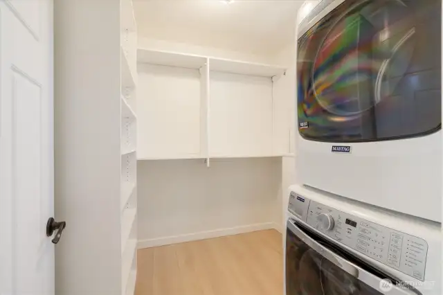 Laundry in large walk-in closet off primary