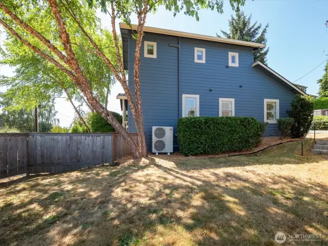Fully fenced side yard for extra play, dog or entertaining area