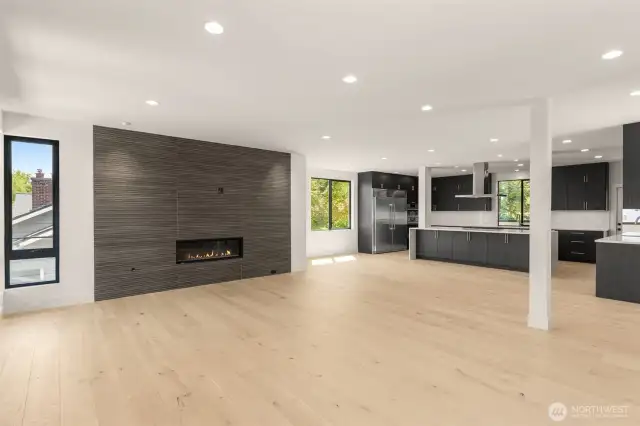 Beautiful hardwood floors with tiled gas fireplace