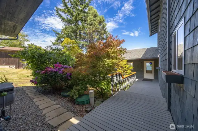 Walking toward the home's front entry door there is a lovely landscaped courtyard to the left.