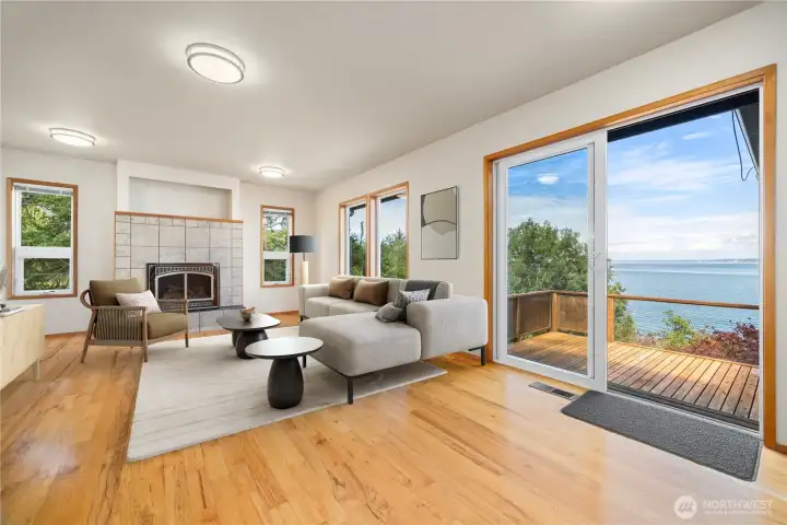 The living room has a lovely gas (propane) fireplace with incredible views and a large sliding glass door that opens onto the westerly facing deck.