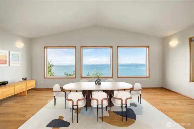 The dining room is surrounded by windows that take in the amazing salt water views.