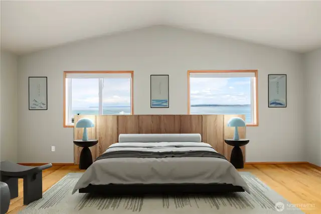 The spacious primary suite has incredible views of the salt water and vistas beyond.