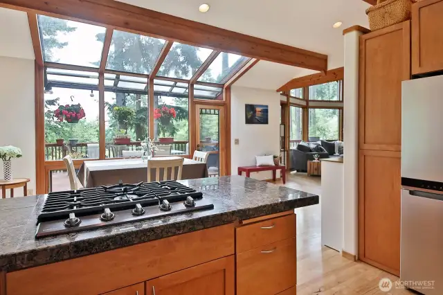 Spacious open floor plan with an atrium dining area that leads to an expansive deck. Ideal home for entertaining and equally ideal for retreating.