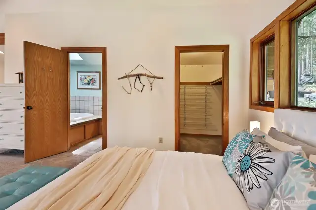Door to the right is your walk-in closet. Let's check out the bathroom which has been freshly painted since this photo was taken.