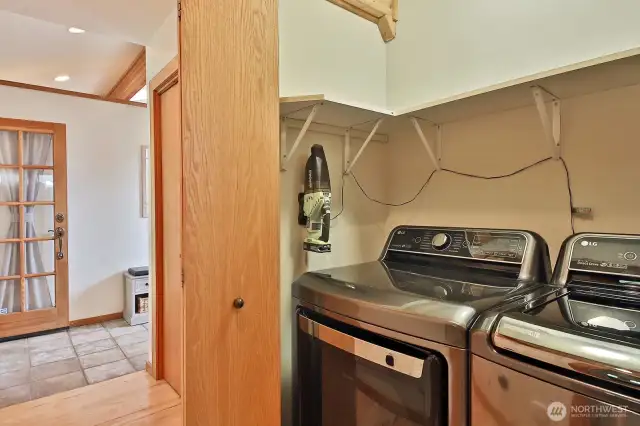 We are back on the main level in the hallway that leads from the entry way to the 2 main level bedrooms, full bath, and stairs to the lower level. Your washer and dryer are in one of the several hallway closets.