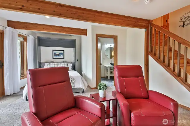 This room currently lives as a family room with a Murphy Bed and it's own 3/4 bath. There is a wonderful storage closet down here and your access to your garage is on this level.