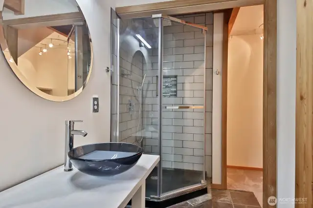 3/4 bath has additional storage area (to the right of the shower).