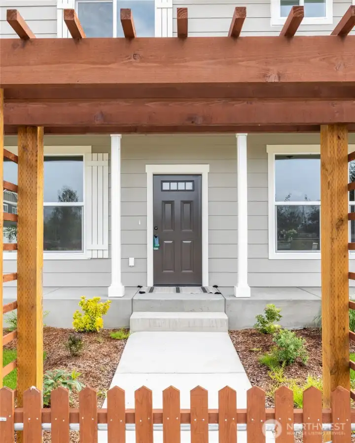 Arbor with gate into front yard