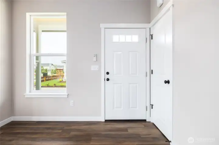 Door by garage.  The great room has LVP flooring.