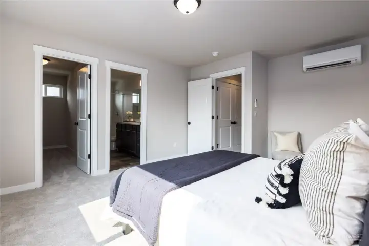 Primary bedroom with walk in closet and bath