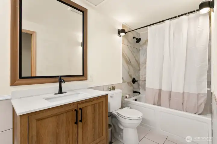 The full-bath has a jetted jacuzzi tub.