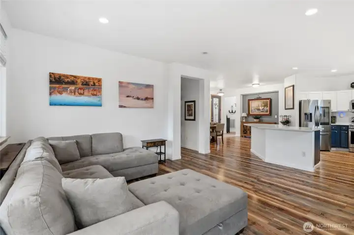 Bright and inviting living space filled with natural light, perfect for relaxing or entertaining.