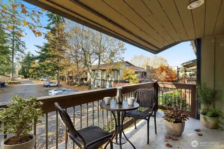 Sliders off living room open to private balcony space (virtually staged)