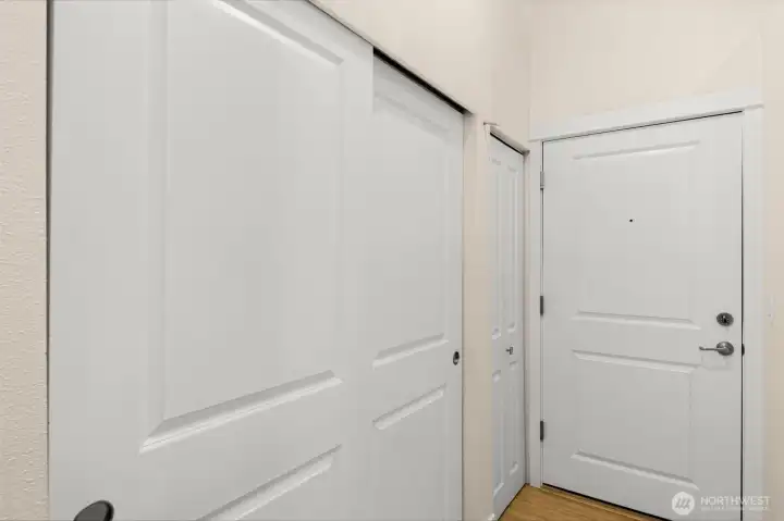 Entry hallway with sliding double-door coat closet