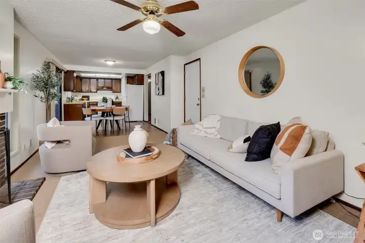 A look from the family room to the eating area and kitchen.  Also note the access to the huge two car attached garage.