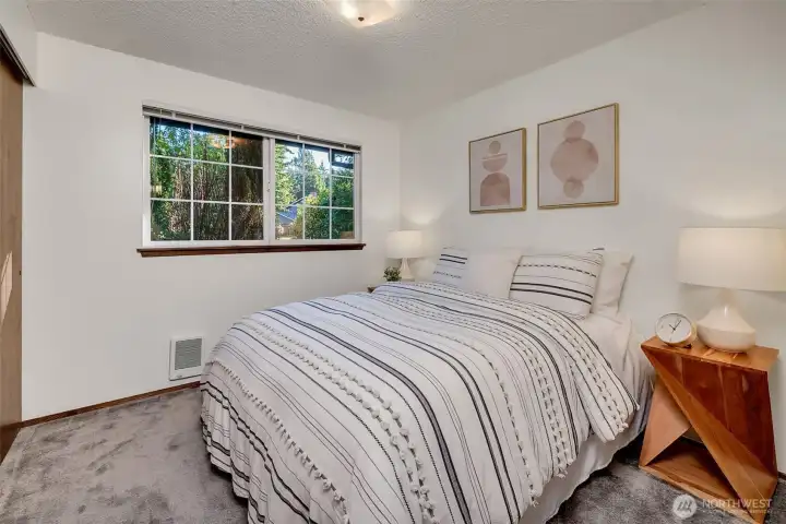 The second of the three bedrooms also features hardwoods under the carpet and plenty of closet space.