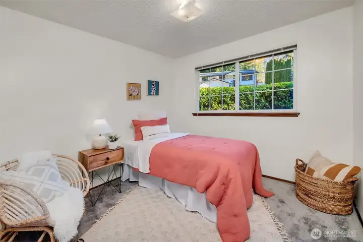 The third of the three bedrooms.  Hardwoods under the carpets and big closet space.