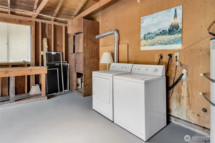 The washer and dryer are located in the garage.