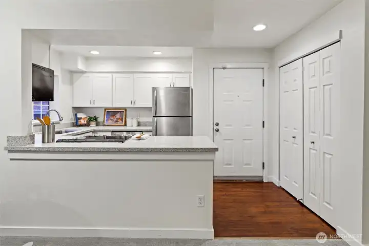 Entry closet to the left of the front door when you walk in.