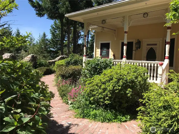 Garden pathways surround the home