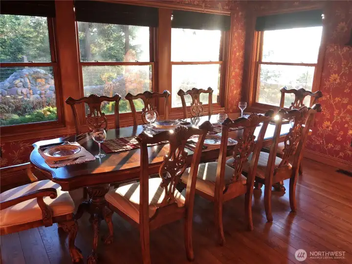 Formal dining room with spectacular light and views over the gardens and East Sound