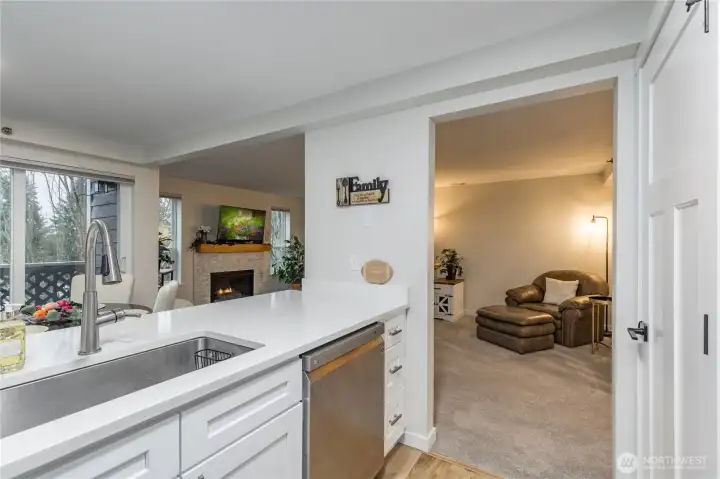 Quartz counters, crisp white cabinets, stainless appliances