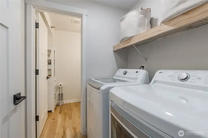 Laundry room connects to a main-floor half bathroom
