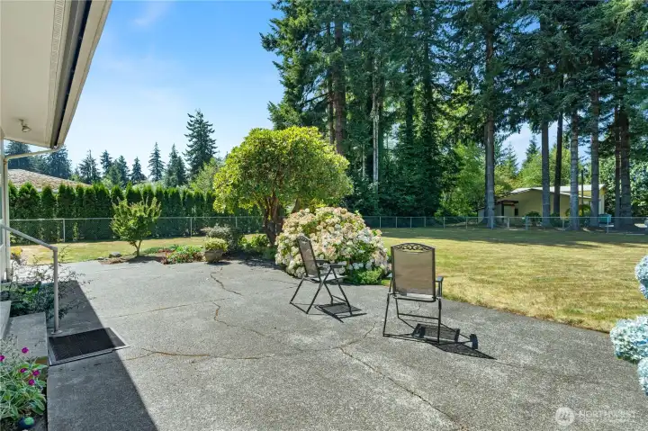 relax on your patio and enjoy the tranquility of your backyard.  That is fully fenced!