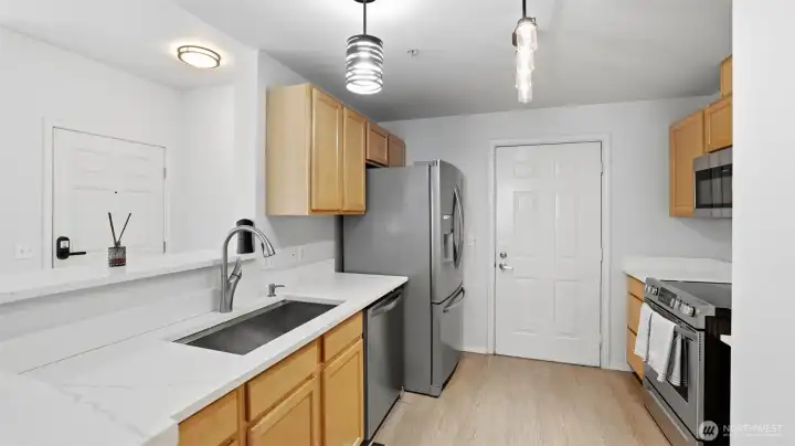 Spacious kitchen peninsula with bar seating — perfect for casual meals or morning coffee