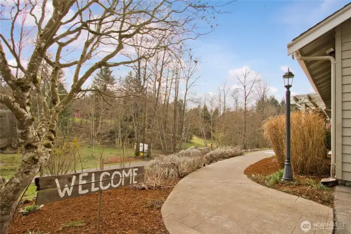 Pathway from driveway leading to the front of home.
