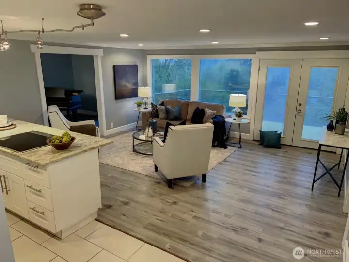 View of living space from entry. Notice the large deck outside.