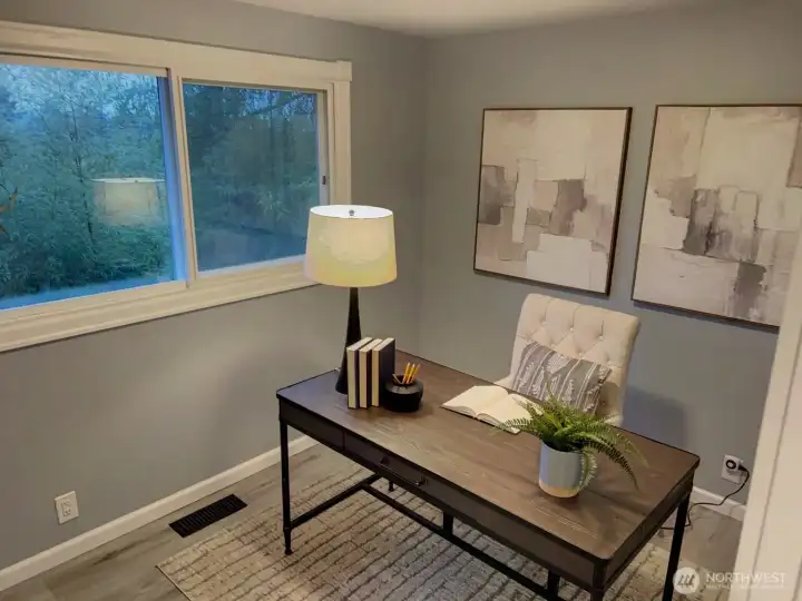 3rd main floor bedroom staged as an office.