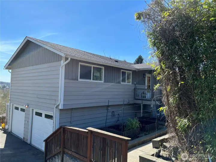 Closeup of house and raised garden beds.