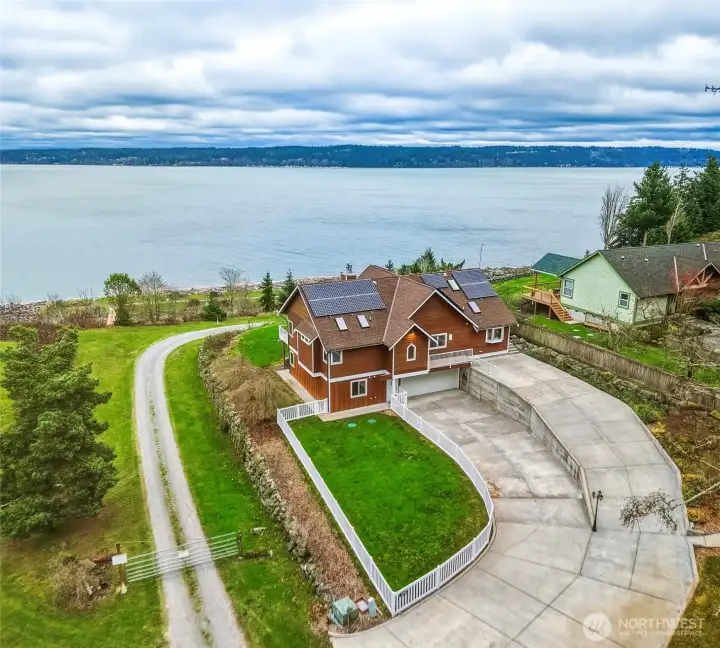 Camano Island Waterfront perfection on 2.7 acres— One of a kind home with private deeded tidelands, walk or drive to direct gated beach access!