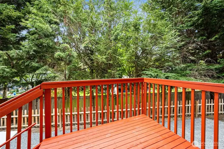 Deck off the kitchen leads to the spacious patio