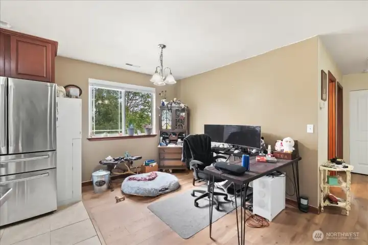 Dining room off of kitchen with tons of natural lighting.
