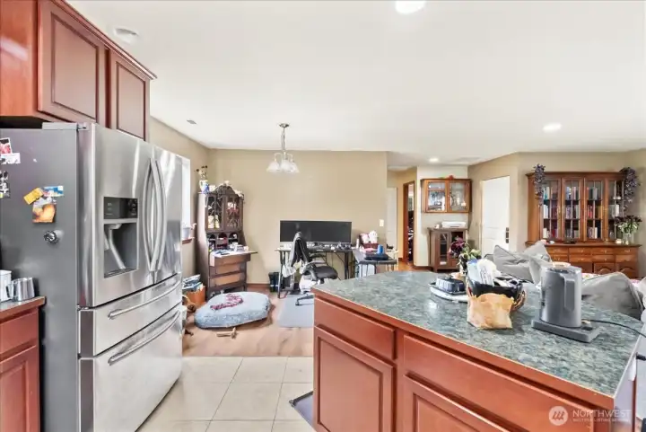 Kitchen over looks dining room and living room.