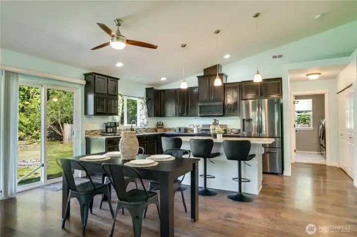Dedicated dining space flows seamlessly from the living room into the kitchen, creating an ideal layout for everyday living and entertaining