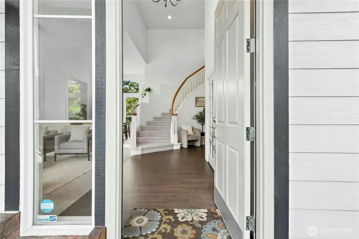 Grand entry with soaring ceilings & abundant natural light