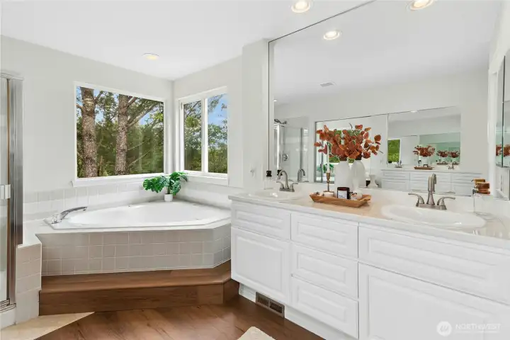 Spacious primary bath with updated countertops & flooring