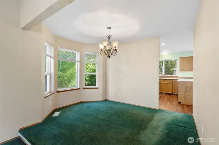 Formal dining room with large bay windows