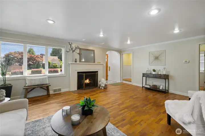 Large living room with beautiful original hardwoods.