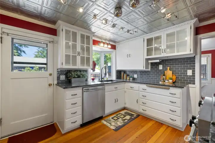 Beautiful granite countertops and tin ceiling tiles